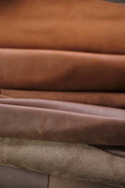 istock Leather brown rolls.Leatherworking.Leather goods material. Genuine leather piece set of brown colors.Hobby and craft.Leather brown pieces assortment. 1308670827