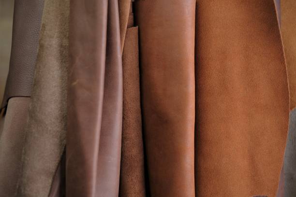 istock Leather brown rolls.Leatherworking.Leather goods material. Genuine leather set of brown colors.Hobby and craft material.Leather brown pieces assortment. 1308670854