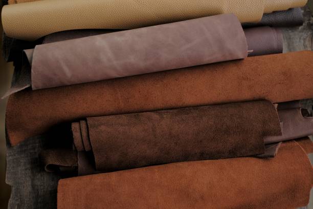 istock Leather brown rolls.Leatherworking.Leather goods material. Genuine leather piece set of brown colors.Hobby and craft material.Leather brown pieces assortment. 1308670890