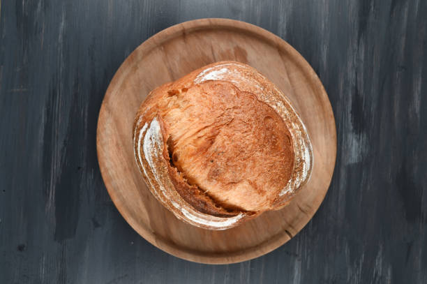 istock homemade bread on a dark wood 1308671712