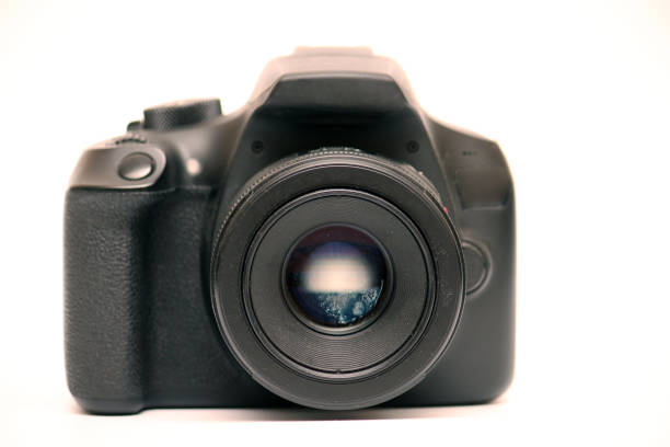 istock No logo digital single-lens reflex camera camera with 50 mm 1.8 aperture prime lens without hood. Front view studio shoot on white background 1308675700