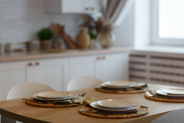 istock White plates with stainless steel spoons and forks 1308677104