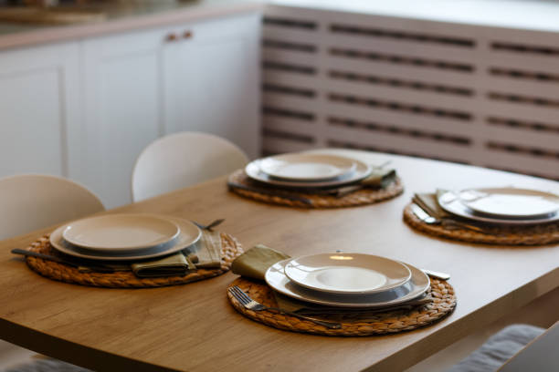 istock White plates with stainless steel spoons and forks 1308677108