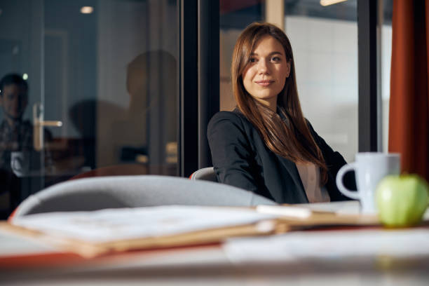 istock Serene young employee looking in front of her 1308677515