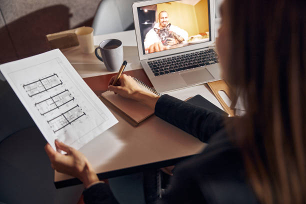 istock Long-haired female engineer working at a new floor plan 1308677660