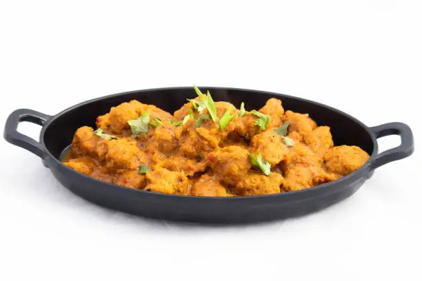 Photo of Veg Curry Masala Sabji Soya Chunks Nutri Nugget Made Of Soy Served In Platter Tray. The Sabzi Is Rich Source Of Protein And Has Multiple Health Benefits. White Background With Space For Text