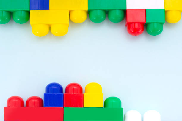 istock Plastic building blocks on a light blue background. Children's educational toys. Children's construction kit. 1308682004