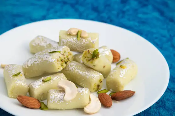 Photo of Delicious Kaju Pista Roll Or Cashew Pistachio Roll Mithai Is Made Of Grated Cashews Mixed With Crumbled Khoya Mawa Kesar Mava Elaichi Khoa In Desi Ghee And Blanched With Almonds And Dry Fruits