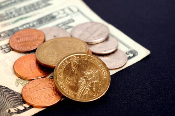 istock US dollars banknotes and coins. American money. 1308682737