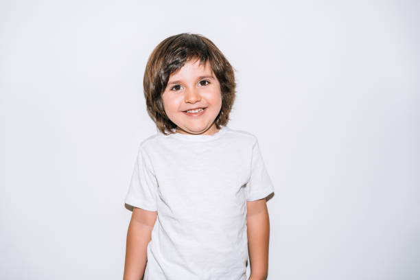 istock very happy little boy smiling on a white background 1308683765