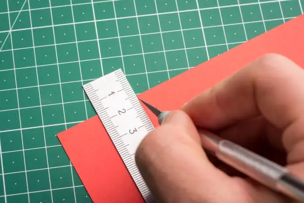 Paper scalpel; ruler and cutting mat