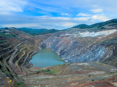 The Berkeley Pit, a former open pit copper mine located in Butte, Montana, is currently one of the largest Superfund sites that is filled with water that is heavily acidic.