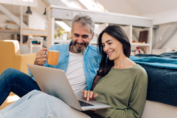 istock Mature couple working online together 1308691547
