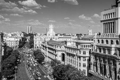 Madrid, June 23, 2015. Traffic on Calle de Alcalá. View of the Circle of Fine Arts, Bank of Spain, Cibeles Fountain, Linares Palace, Post Office Building, later City Hall and Puerta de Alcalá.