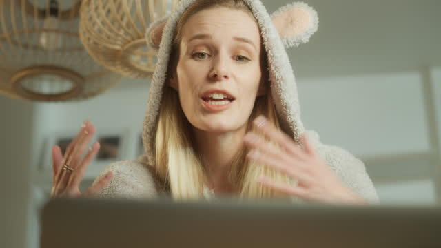 Vlogging. Woman doing video call in cute bear onesie