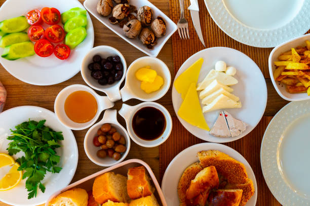 istock Turkish halal breakfast with egg, cheese, bread, vegetables, olives, sauces, walnuts 1308695118
