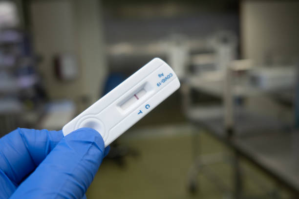 istock negative Corona Covid test is held by a blue gloved hand 1308695329