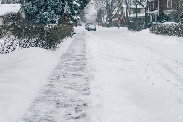istock Winter Cityscape - Shoveled Sideway/Pavement in the Wintertime 1308698789