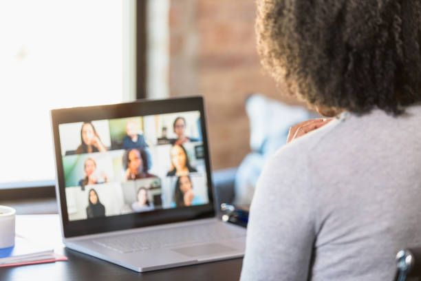 istock Unrecognizable woman holds virtual meeting with diverse colleagues 1308699360