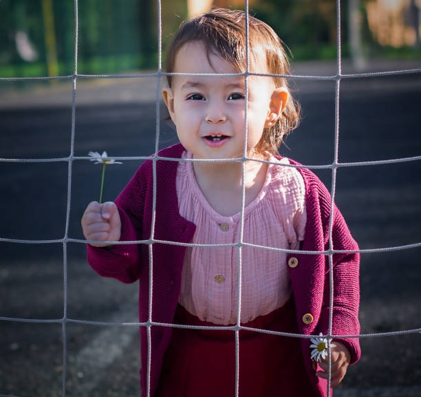 istock Girl playing hide and seek 1308699580