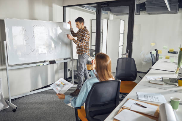 istock Architects working at a new building project in the office 1308700279