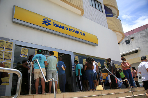 salvador, bahia, brazil - january 21, 2021: people are seen in line at the entrance to the Banco do Brasil branch in the Itapua district in the city of Salvador.\