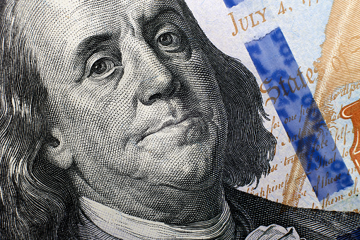 Close up portrait of Benjamin Franklin on a 100 dollar bill