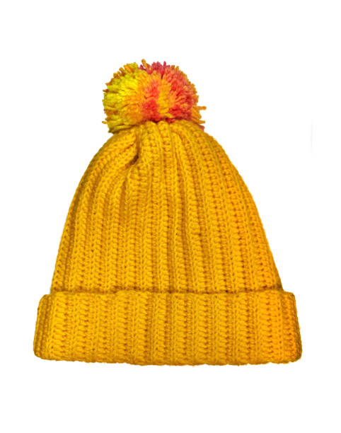 istock Yellow crocheted cap with pom-pom. 1308704032