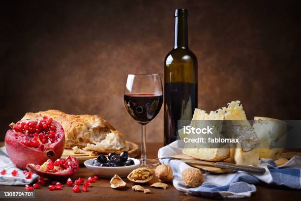 Red Wine Cheese Walnuts Olives Pomegranate And Bread Stock Photo - Download Image Now