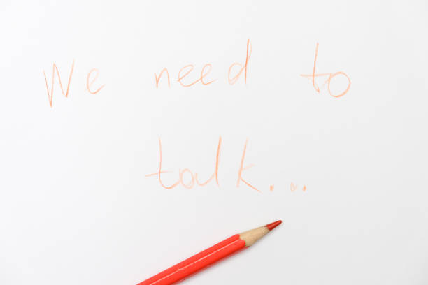 istock We need to talk message written on white paper, communication problems in family or work office space 1308704890