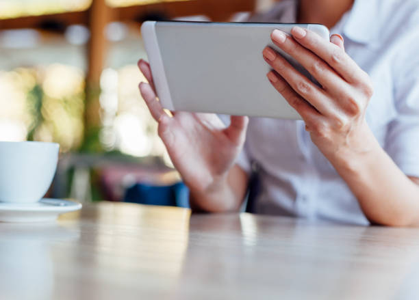 istock Woman Holding Tablet 1308706606
