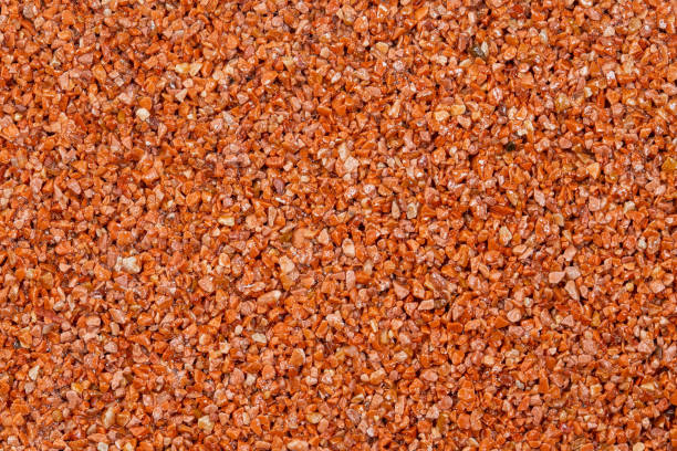 istock textural plaster of the house wall, colored granite chips, background 1308706980