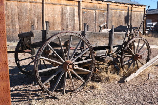 istock Old rustic wooden buildings, stage coach and wind mill 1308709534