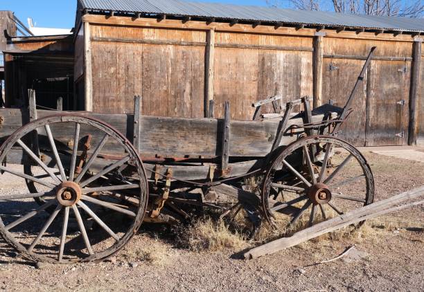 istock Old rustic wooden buildings, stage coach and wind mill 1308709547