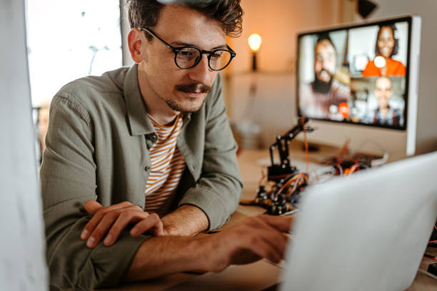 istock Online working with friends 1308709567