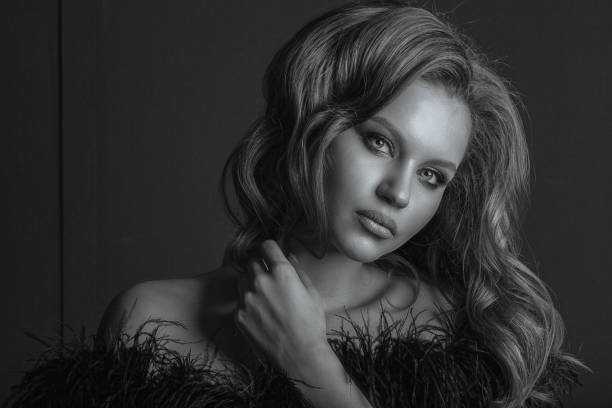 istock Lovely model with professional makeup, posing in the shadows 1308719261