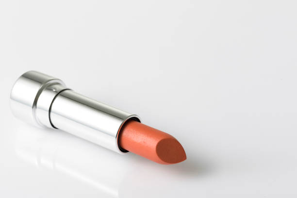 istock Lipstick lay on acrylic table with empty space on the right side 1308723175