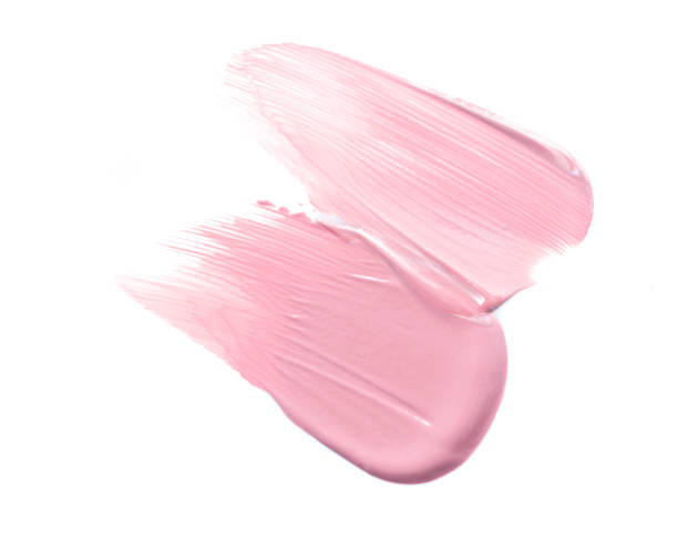 istock Pink color tone make up base in abstract shape on white background 1308723686