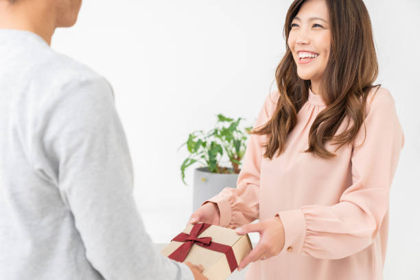 istock couple at modern home , present 1308731140