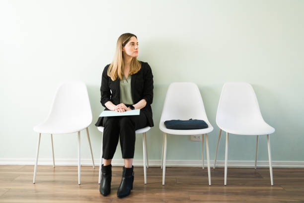 istock Attractive female applicant waiting for her job interview 1308731751