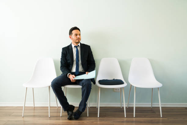 istock Attractive businessman holding a folder with his resume 1308731882