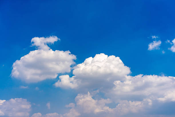 istock Cotton like white clouds on blue sky background 1308733564