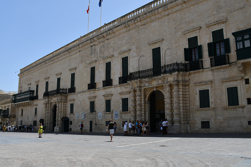 Valletta, Malta - July 10, 2019: The Grandmaster's Palace in St. George's Square, which now houses the Office of the President of Malta as well as a museum.
