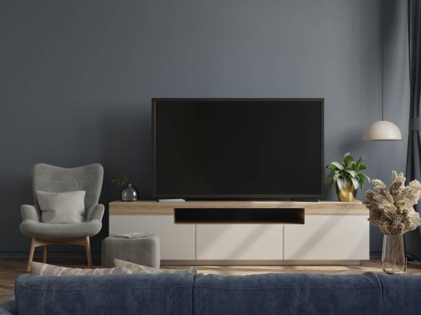 istock Mockup tv on cabinet in modern empty room with the dark wall. 1308740098