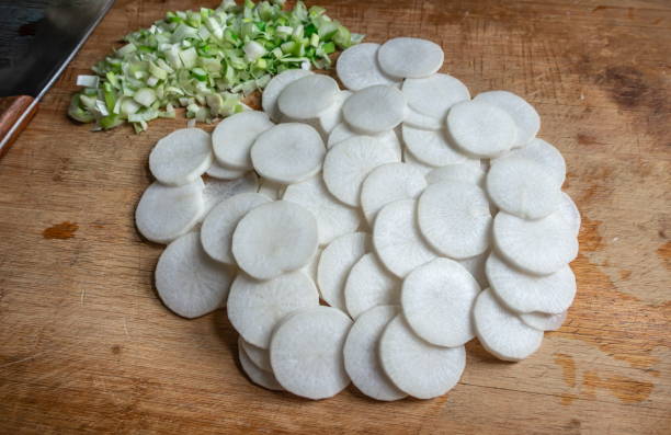 White organic radishes on wooden table