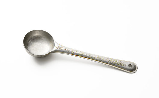 High angle view of old aluminum serving ladle isolated on white with clipping path.