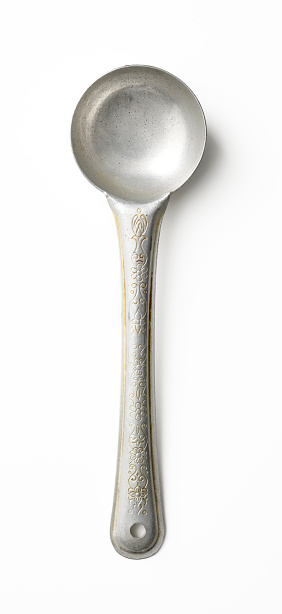 Overhead shot of old aluminum serving ladle isolated on white with clipping path.