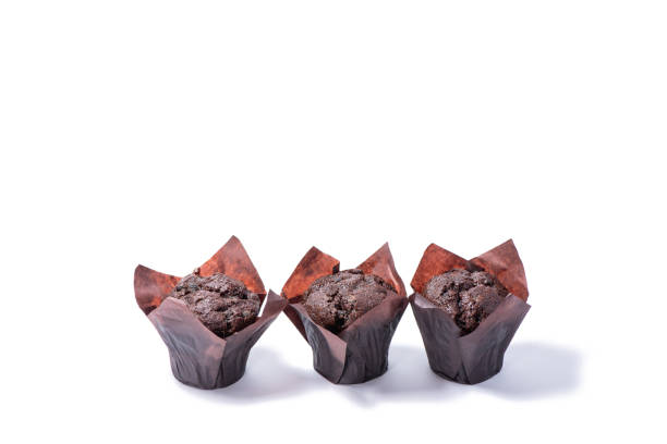 istock Delicious baked chocolate muffins on white background. 1308768241