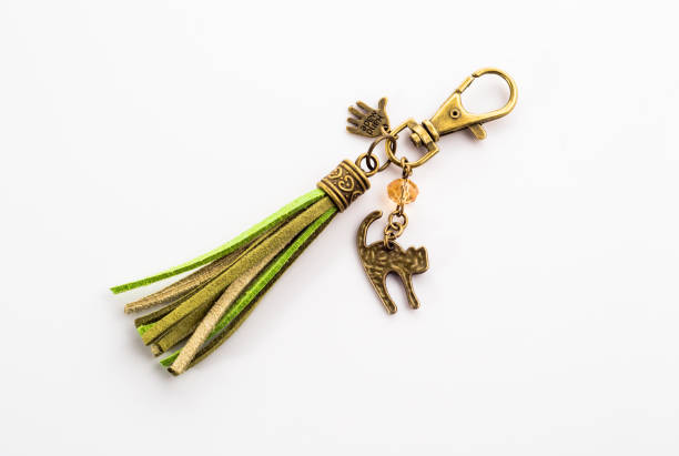 istock Fashionable key ring isolated on white, stylish boho jewelry 1308768807