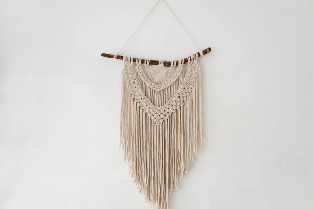 istock Handmade 100 cotton macrame wall decor hanging on a white wall. 1308776329